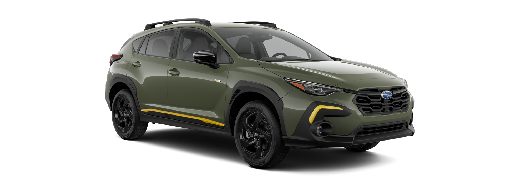 A green Subaru Crosstrek SUV with black trim and yellow accents on the side and front bumper, viewed from the front-right