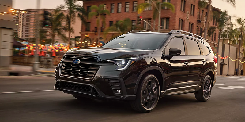 Black Three-Row SUV Showcasing Premium Exterior Styling in an Urban Environment