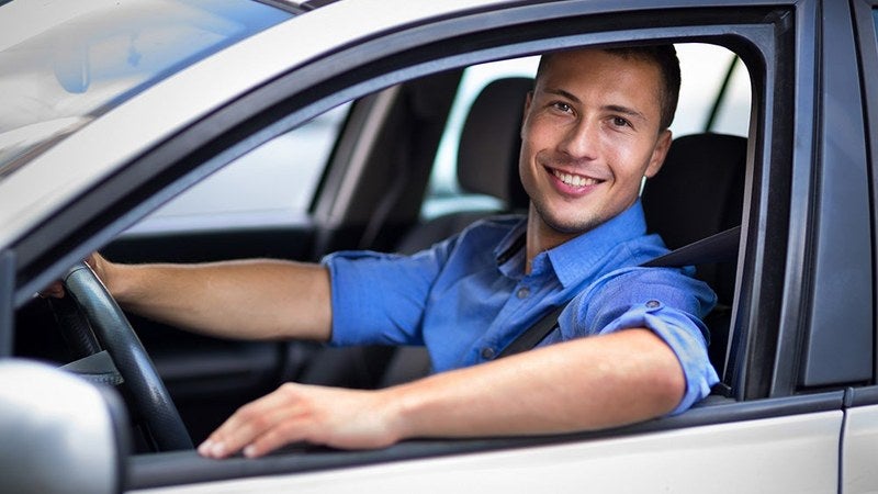 A satisfied customer with a new vehicle