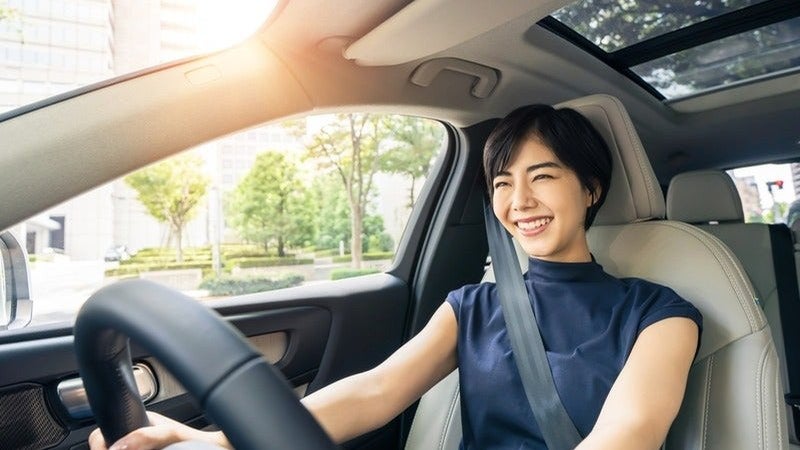 Driver using advanced driver-assist technology on the road