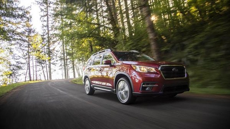 Subaru Ascent in red, front three-quarter on a forest road