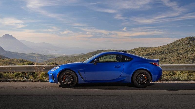 2024 Subaru BRZ in blue, front three-quarter on a mountain road