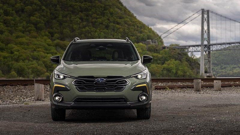 2024 Subaru Crosstrek in green, three-quarter view outdoors