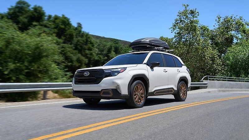 Subaru Forester Wilderness in white, front three-quarter on a mountain road