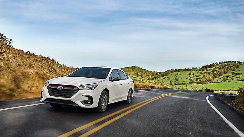 2025 Subaru Legacy sedan in white, front three-quarter on a road