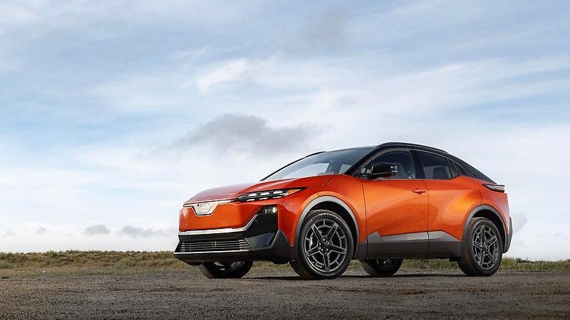 2026 Subaru Uncharted electric SUV in orange, front three-quarter overlook