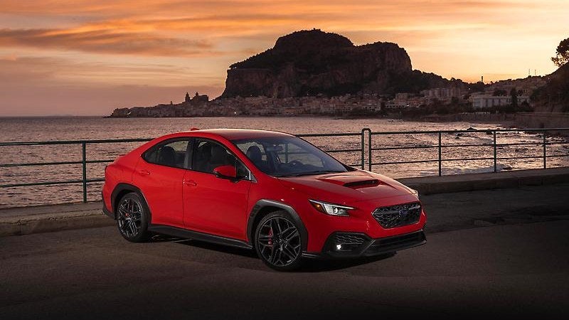 2026 Subaru WRX sport sedan, front three-quarter view on a coastal road
