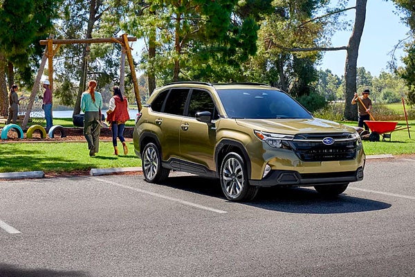 White Subaru Forester driving on a city street, illustrating blind-spot sensor waves.
