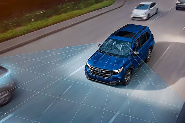 High-angle view of a blue Subaru Forester driving on a road with graphic lines showing sensor coverage.
